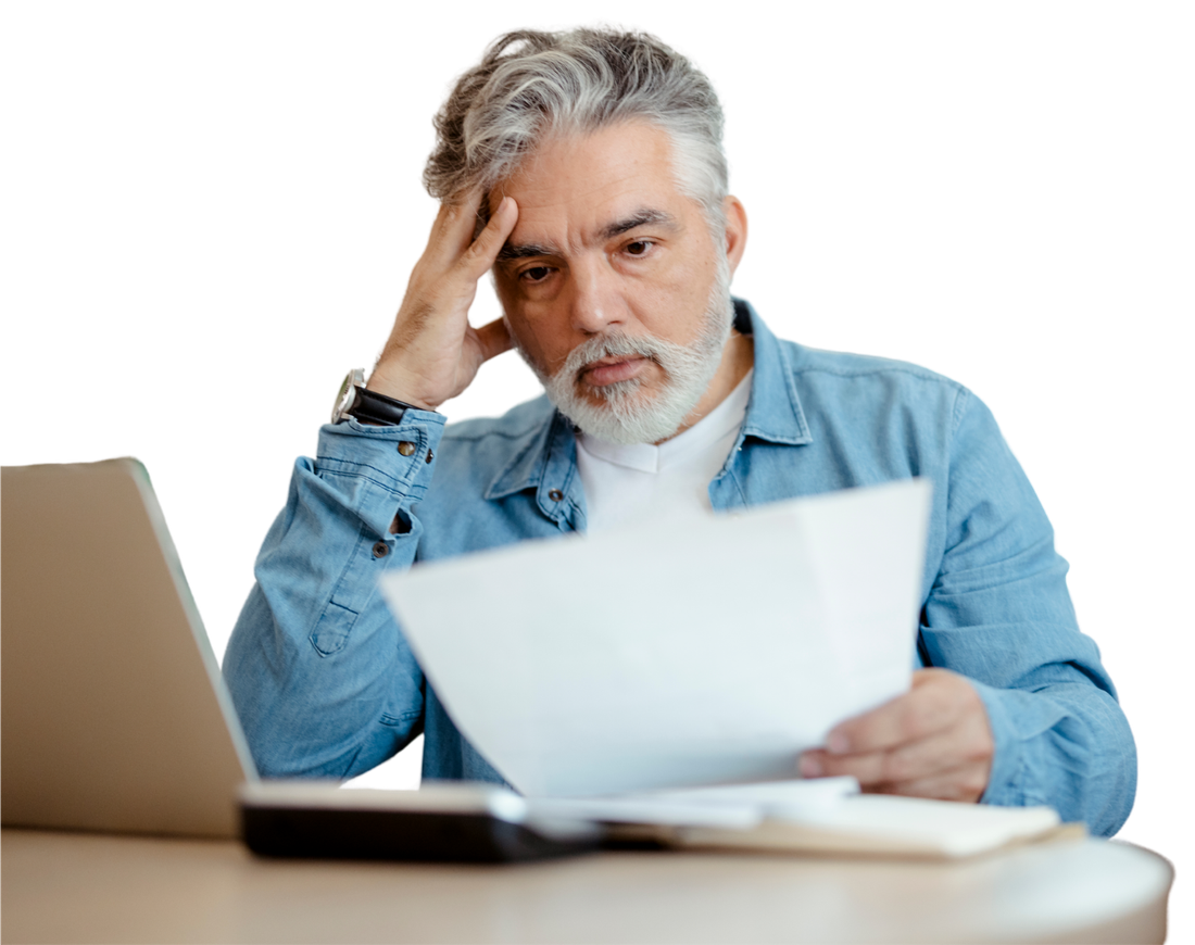 Car owner reviewing a car repair quote and paperwork at a laptop