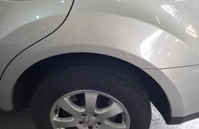 Rear wheel arch of an SUV with air suspension, in the Hermanus workshop