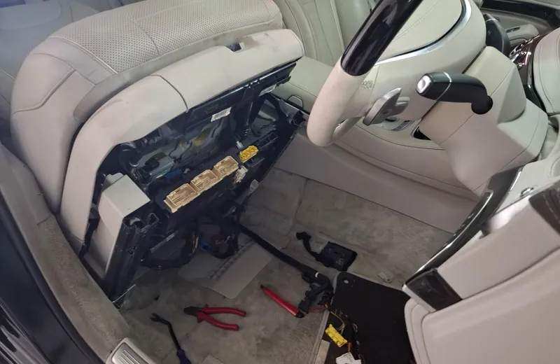 Fuse box and control modules opened up during electrical fault finding on a Mercedes at Fangio Auto Hermanus