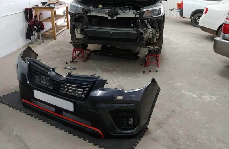 Subaru Forester with the front bumper removed for a headlight job at Fangio Auto Hermanus