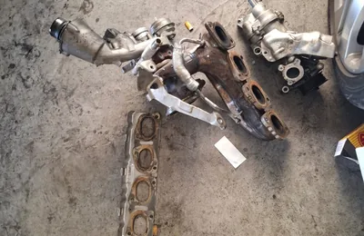 Turbo and related parts removed from a car at Fangio Auto