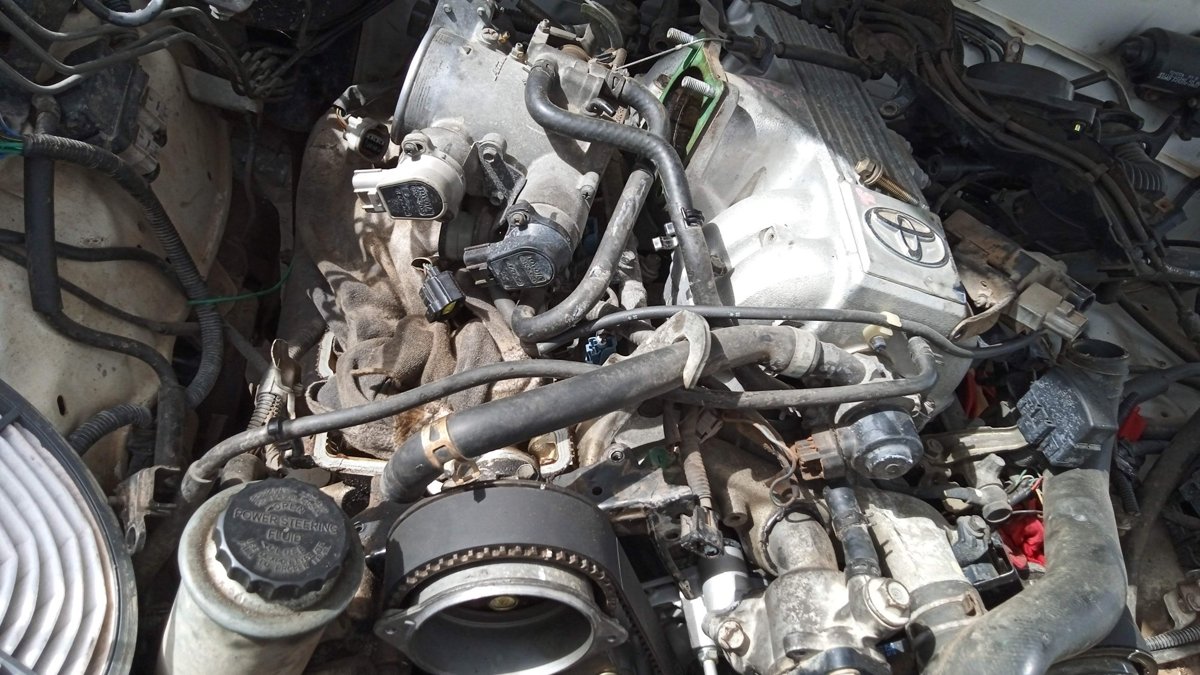 Dirty throttle body and intake hoses on an engine