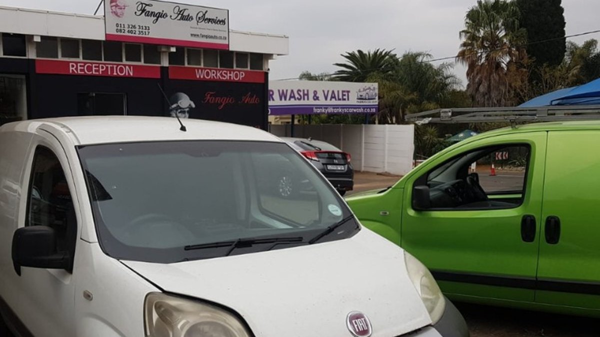 Fiat Fiorino van parked outside the Fangio workshop reception