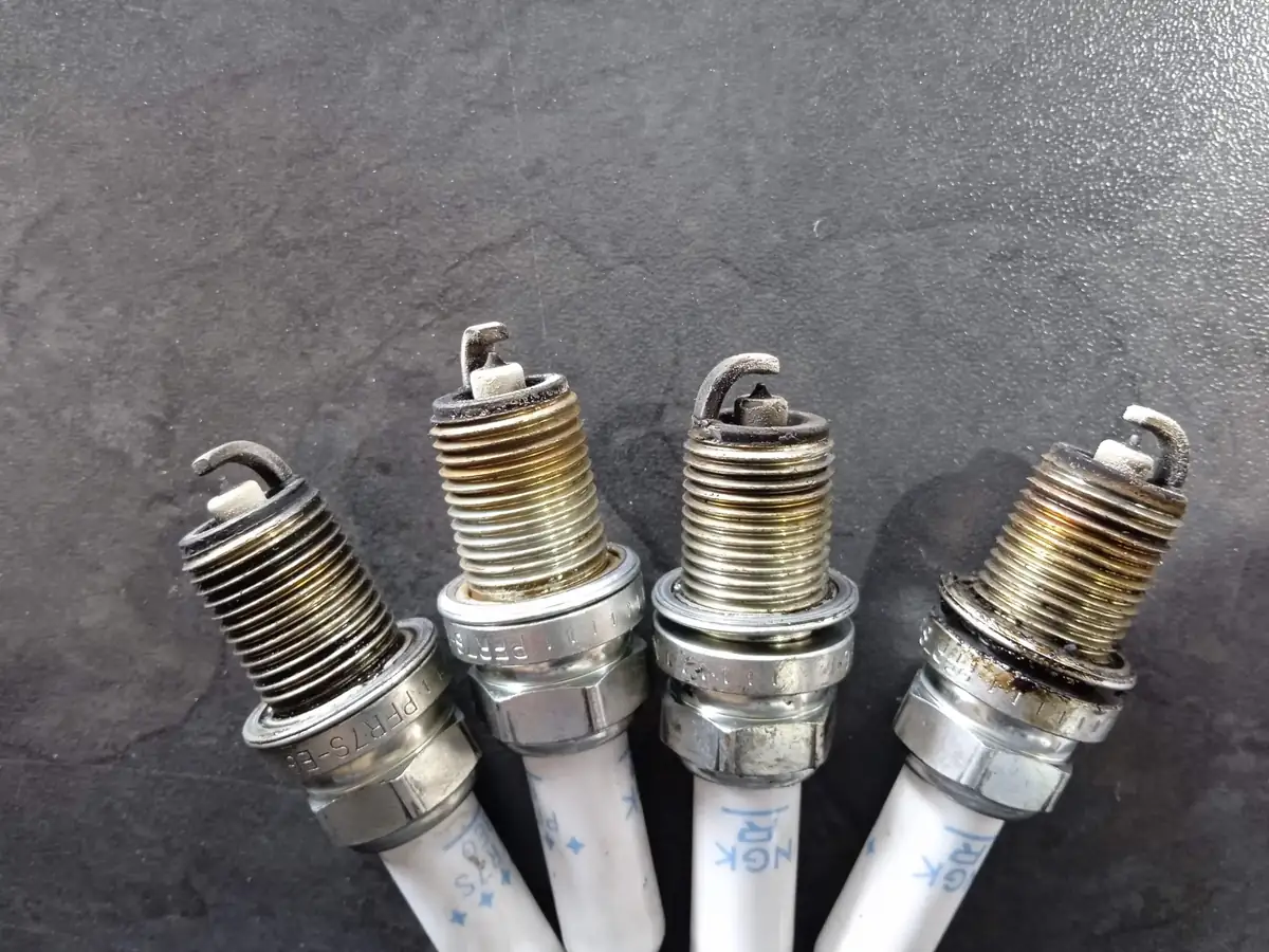 Group of spark plugs sitting next to each other