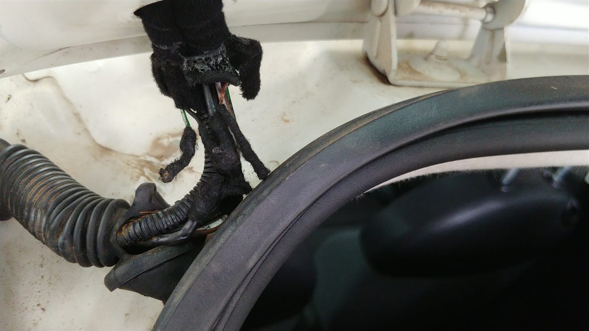 Damaged boot lock wiring loom found by an auto electrician in Hermanus
