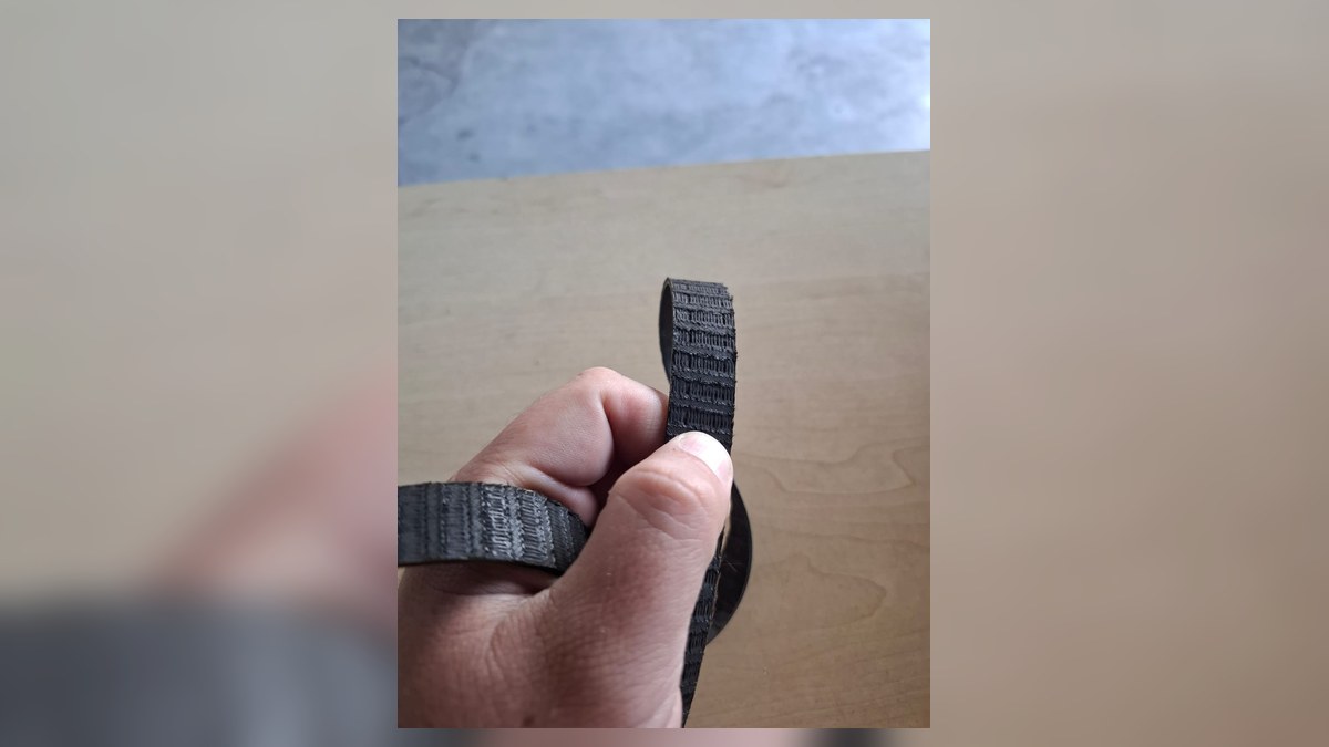 Damaged balance shaft belt removed from a Mitsubishi Pajero after a rattling noise diagnosis