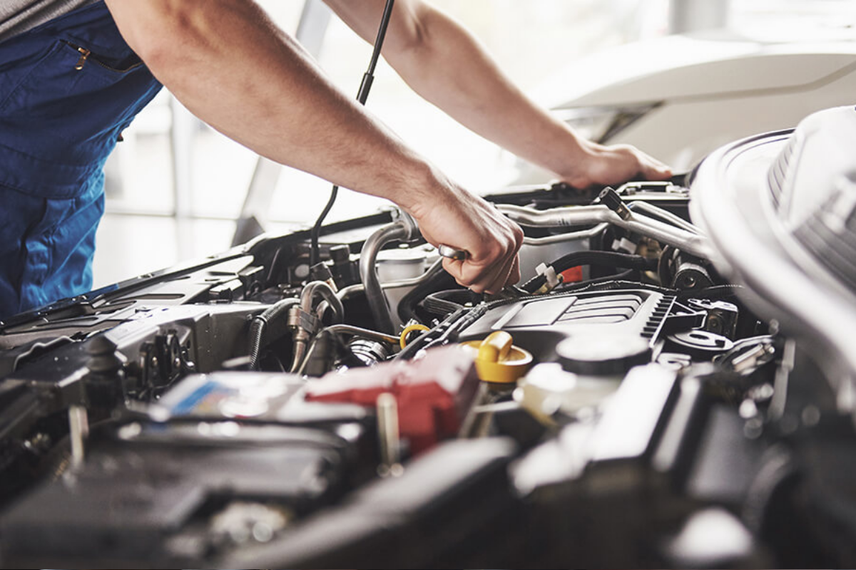 car repairs randburg mechanic inspecting engine at Fangio Auto workshop