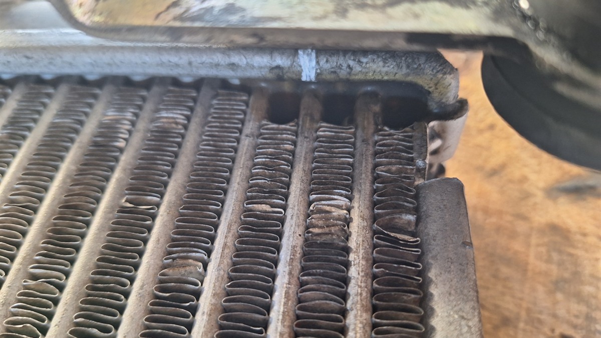 Damaged intercooler core inspected for an oil leak