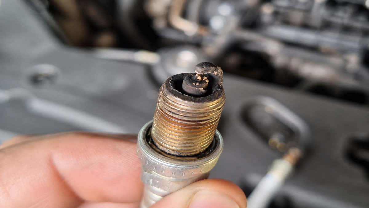 Close-up of oil fouling on the firing end of a spark plug