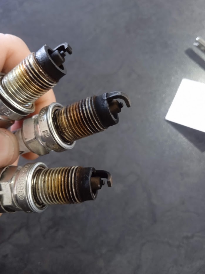 Used spark plugs removed from a petrol engine during a service in Hermanus