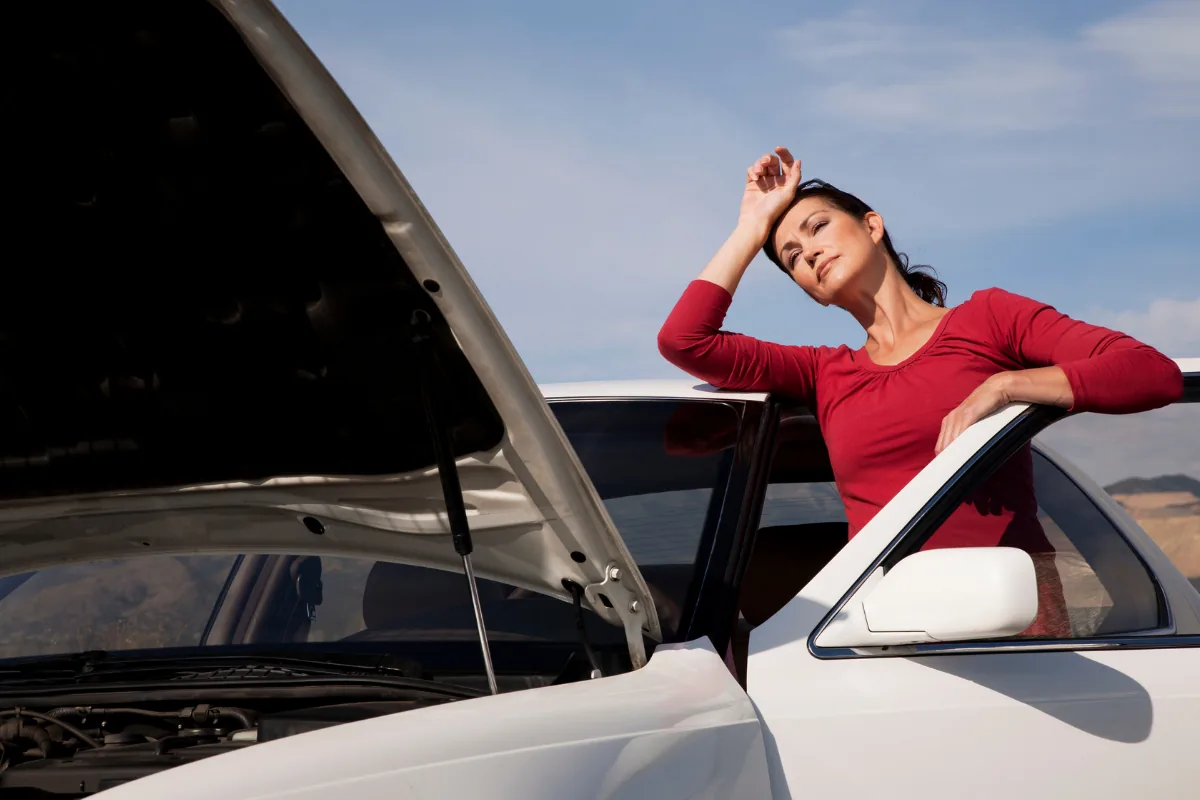when to change the cambelt - mechanic inspecting timing belt at Fangio Auto Service Randburg